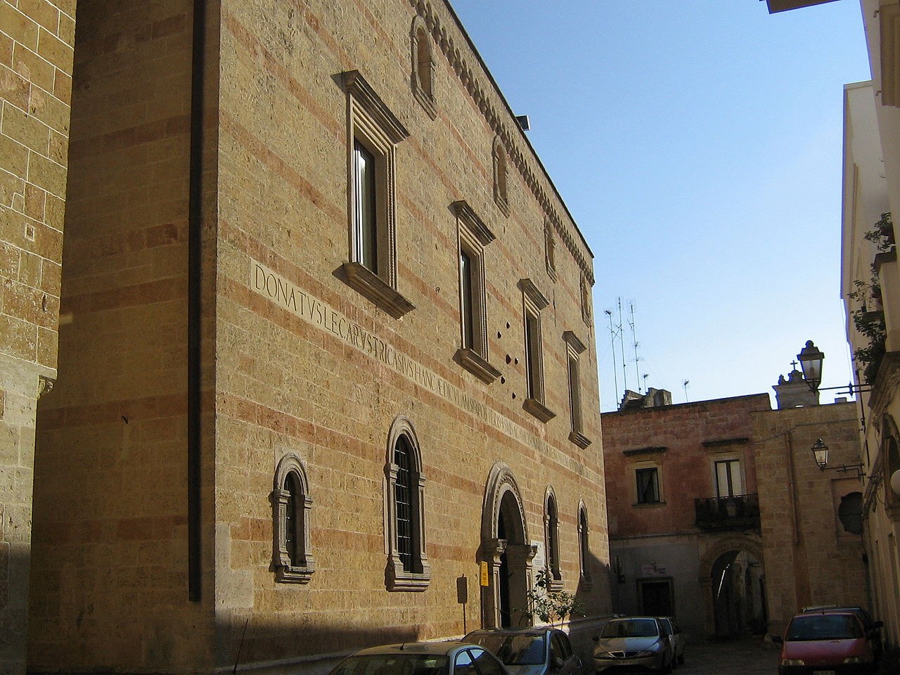 A narrow historic street in Alessano