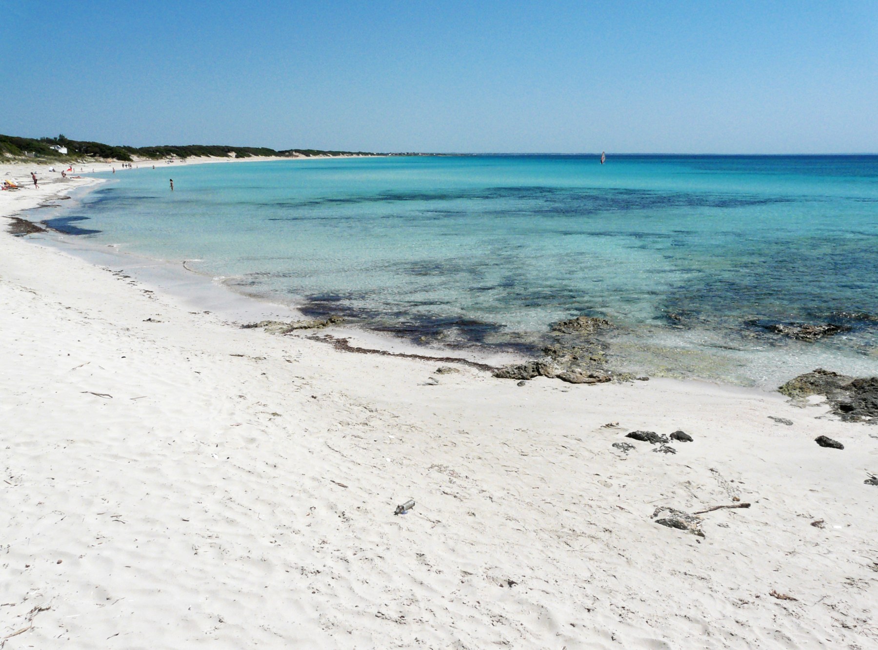 White sand and clear turquoise water at Punta Prosciutto, Porto Cesareo