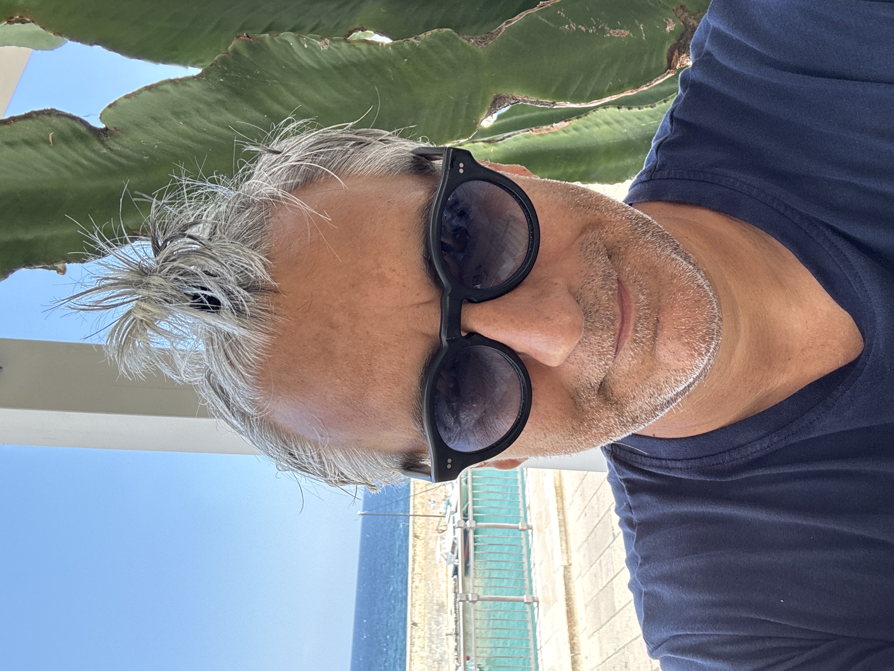 Renato Bortone by the sea, beside a prickly pear cactus