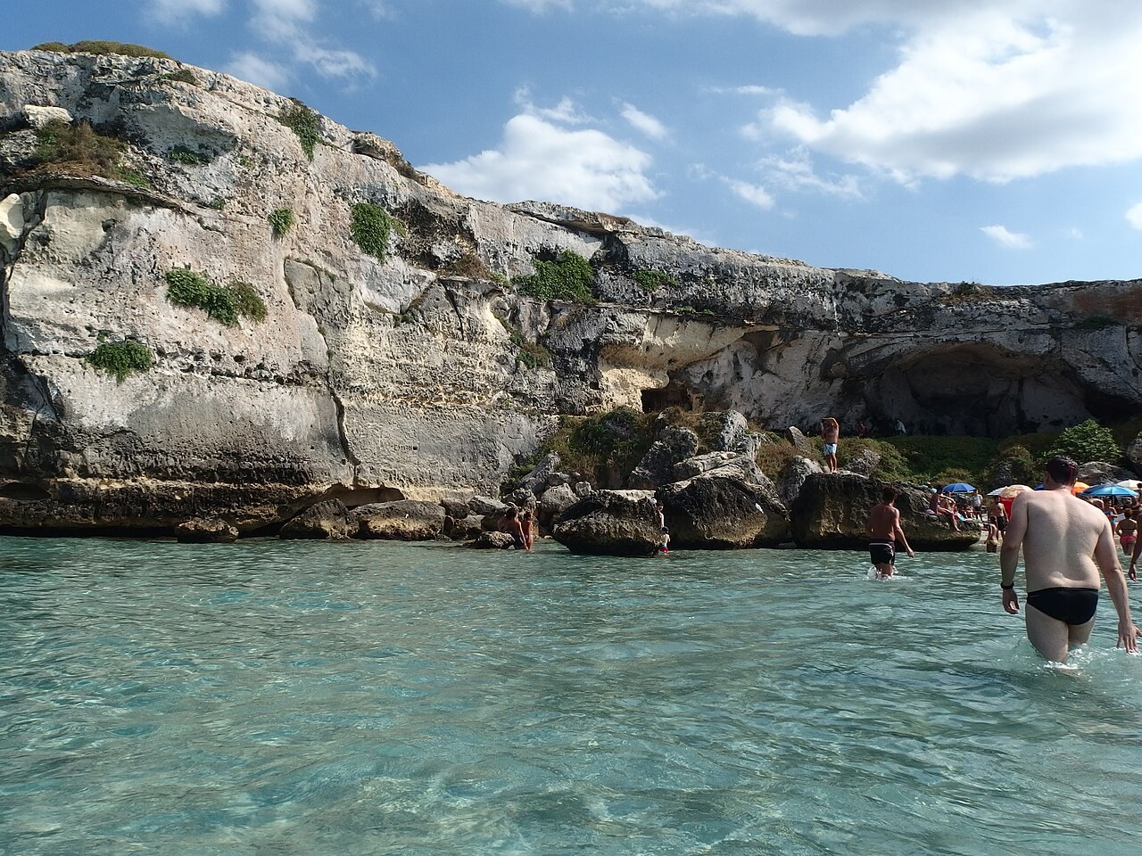 Clear water and pale limestone cliffs at Torre dell’Orso